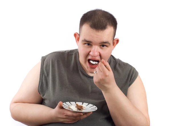 stock image Man eats cake