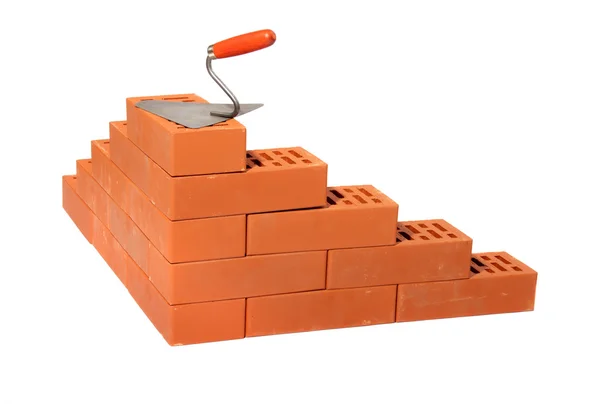 Red bricks and trowel — Stock Photo, Image