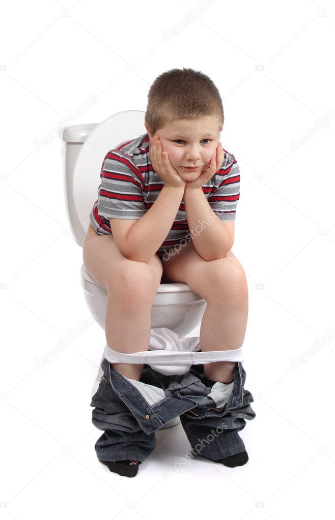 Little boy is sitting on toilet