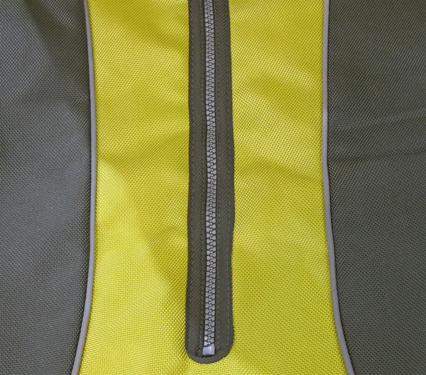 Black zip on yellow clothing concept — Stock Photo, Image