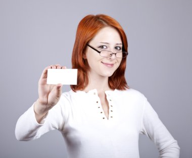 Portrait of an young beautiful happy woman with blank white card clipart