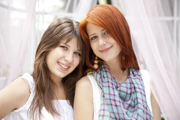 Portrait of two beautiful girls at outdoor. — Stock Photo, Image