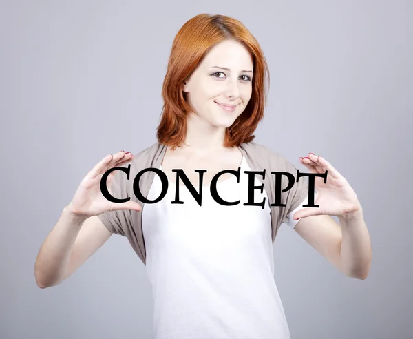 Red-haired businesswoman show abstract word "concept'&#03 — Stock Photo, Image