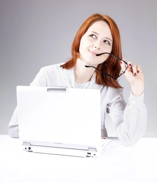 Red-haired girl with white notebook. Studio shot. — Stock Photo, Image
