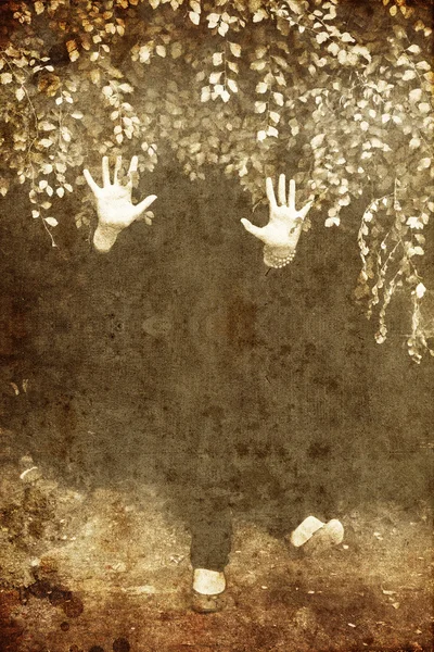 Silhouette hands and foots under leafs. Photo in old image style. — Stock Photo, Image