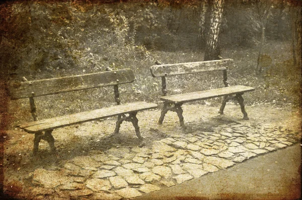 Two Park Benches. Photo in old image style