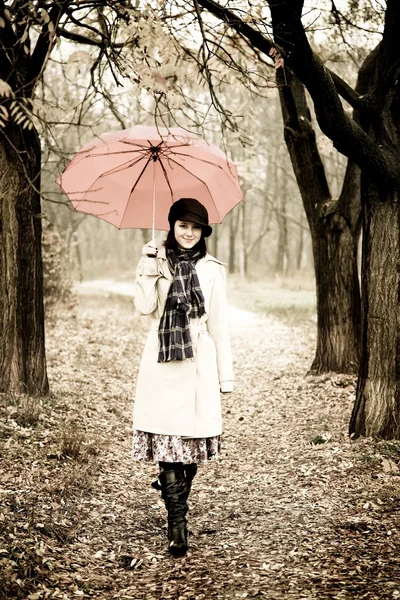 Girl with umbrella at park in rainy day. Photo in vintage style — Stock Photo, Image