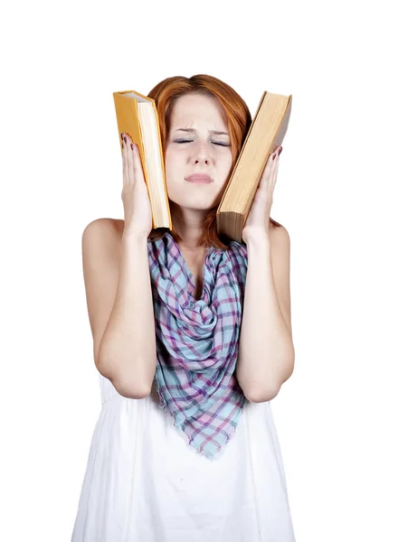 Молодой студент с двумя книгами и головной болью . — стоковое фото