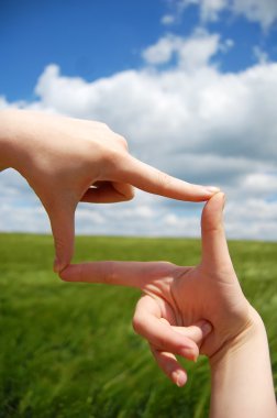 Frame made of hands at wheat field clipart