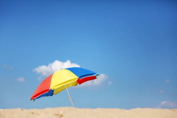 Umbrella on sand — Stock Photo, Image
