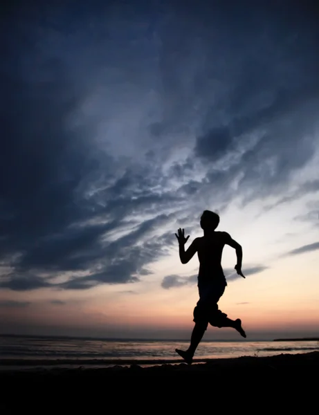 stock image Runner on the beach at sunset