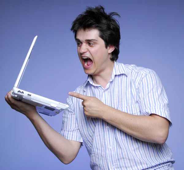 Angry boy with white notebook. Studios photo — Stock Photo, Image