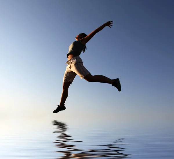 Fantastic jump over water — Stock Photo, Image