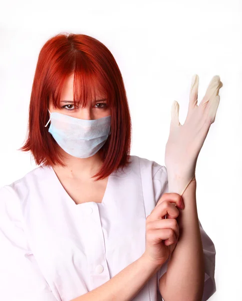 Red-haired nurse with glove — Stock Photo, Image