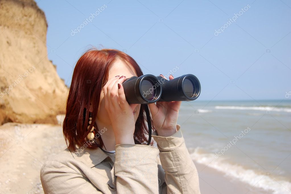 Girl with binocular at beach. Stock Photo by ©massonforstock 3592859