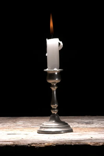 Svíčka nad černou — Stock fotografie