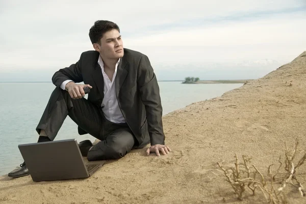 Businessman at the beach — Stock Photo, Image