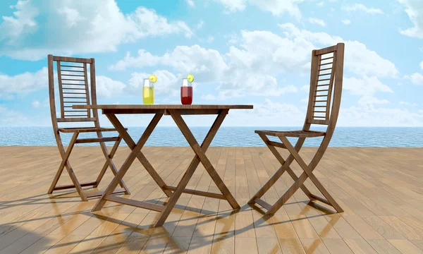 Table in front of sea — Stock Photo, Image