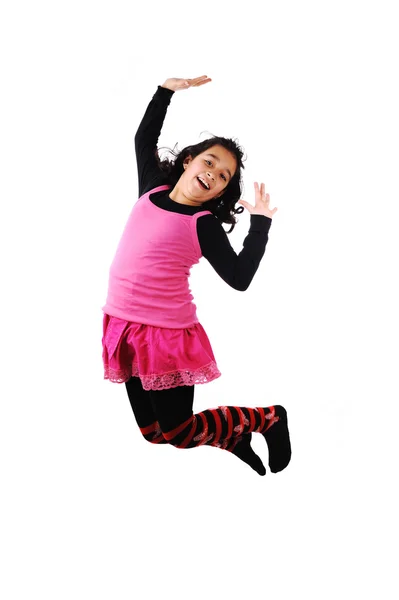 Entzückendes Kind springt über weißem Hintergrund — Stockfoto