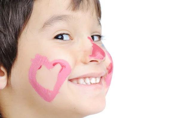 Happy kid with colored heart on his cheek — Stock Photo, Image