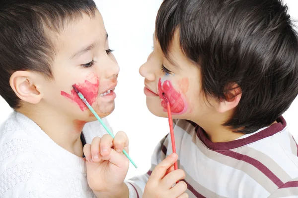 Cute little boy getting make-up on his face — Stock Photo, Image