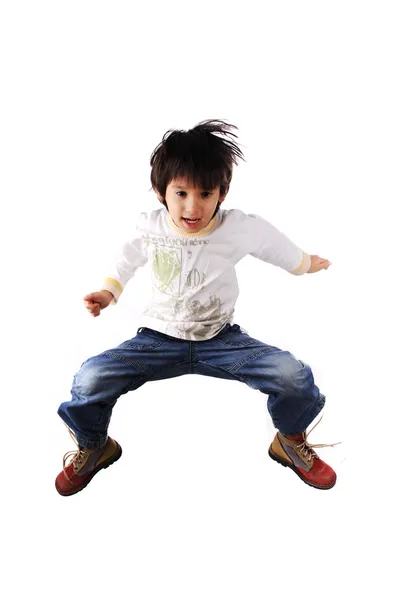 Чарівна дитина стрибає над білим тлом — стокове фото