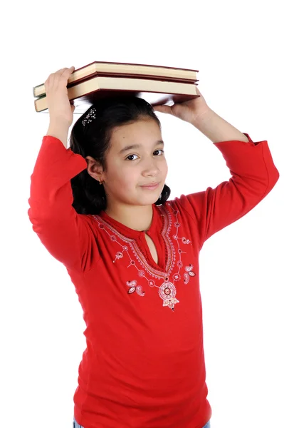 Kislány rövid idő tárolás a könyvek gondolkodás — Stock Fotó