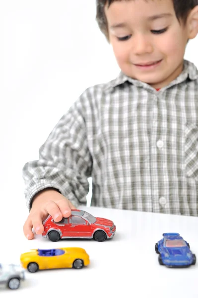 Kid playing with cars — Stock Photo, Image