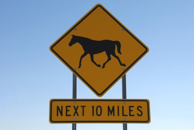 Horse Crossing Next 10 Miles clipart