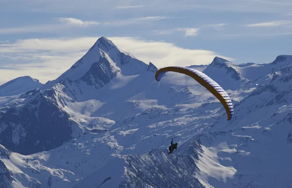 stock image Winter paragliding in alps mountains