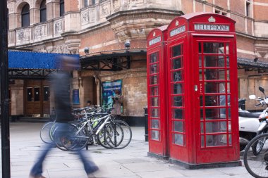 Red phone boxes in london clipart