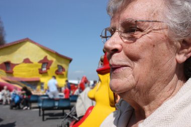 Senior old lady at the seaside clipart