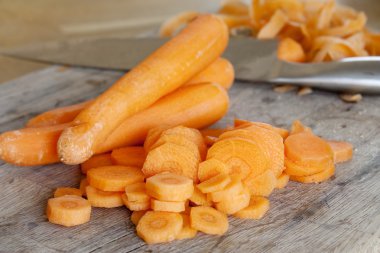 Carrots on a chopping board clipart