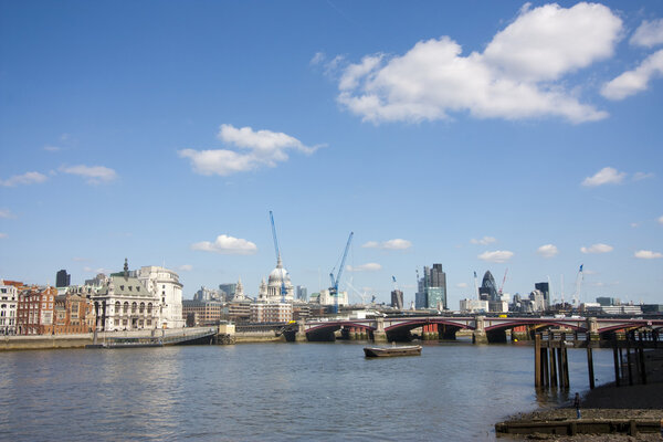 London city skyline at midday in spring with lots of cranes and construction