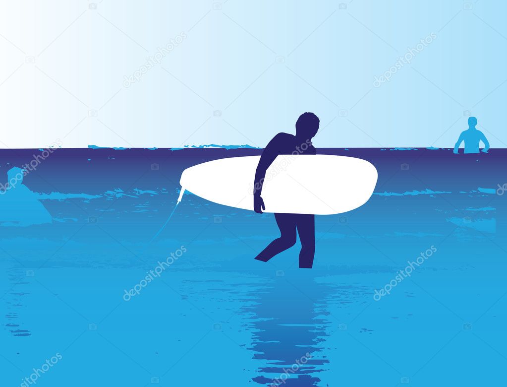 Surfer walking in the ocean