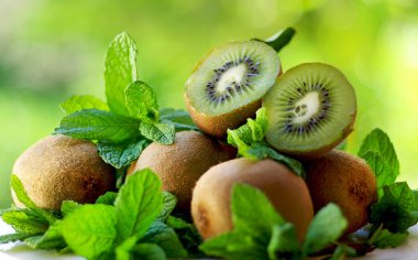 Kiwis and aromatic herbs. clipart