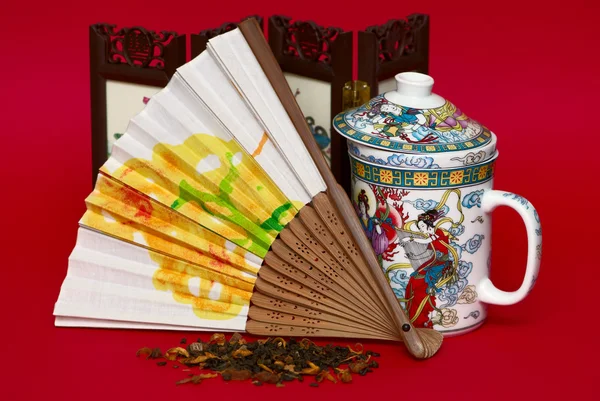 Fan and cup in asian style — Stock Photo, Image