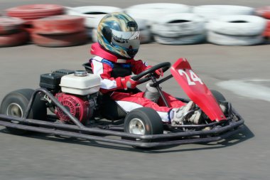 Young racer on circuit clipart