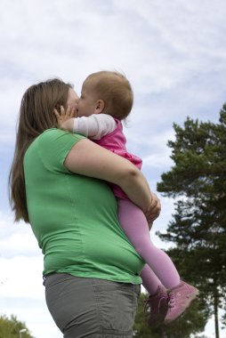 Kissing obese mother clipart