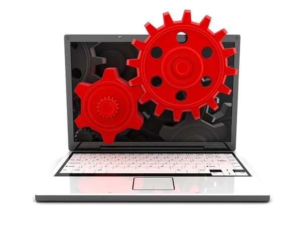 Ноутбук и шестерни красный — стоковое фото