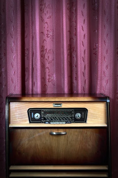 stock image Old vintage radio on red background