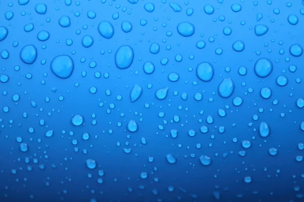 Blue background with drops Royalty Free Stock Photos