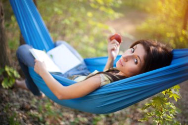 Relaxing in a Hammock clipart