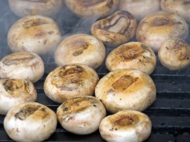 Mushrooms on grill clipart