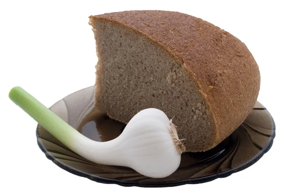 Brot und Knoblauch auf dem Teller — Stockfoto