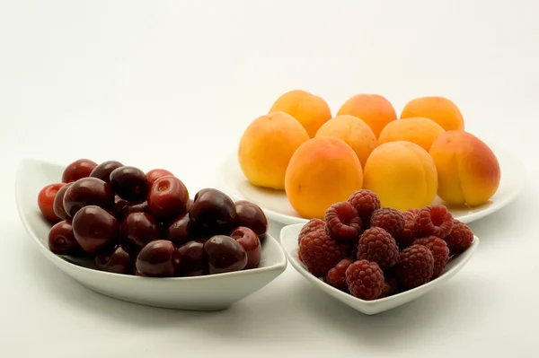 Apricots, raspberry and cherries — Stock Photo, Image