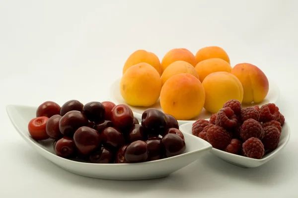 Apricots, raspberry and cherries — Stock Photo, Image