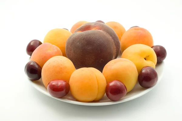 Apricots, peach and cherries — Stock Photo, Image