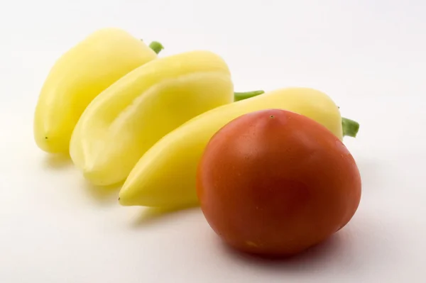 Sweet peppers and tomato — Stock Photo, Image