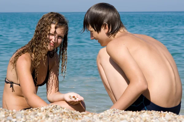 stock image Boy and girl on the beach